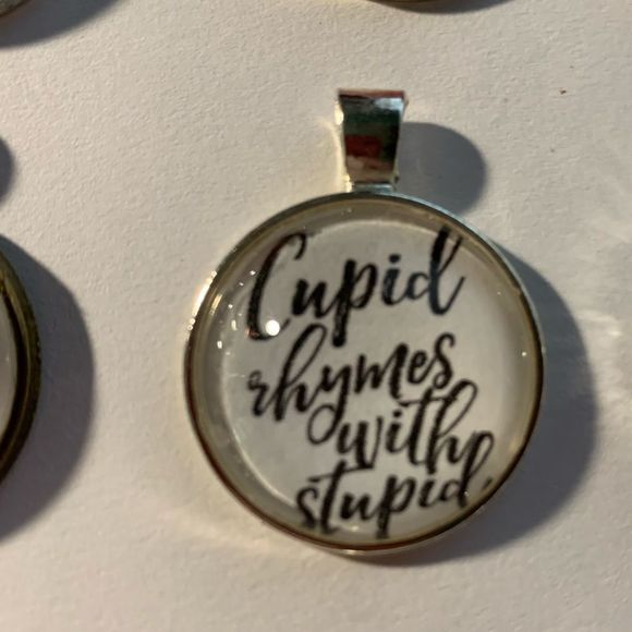 Cupid rhymes with Stupid -silvertone pendant with vegan leather cord NEW - Picture 2 of 2